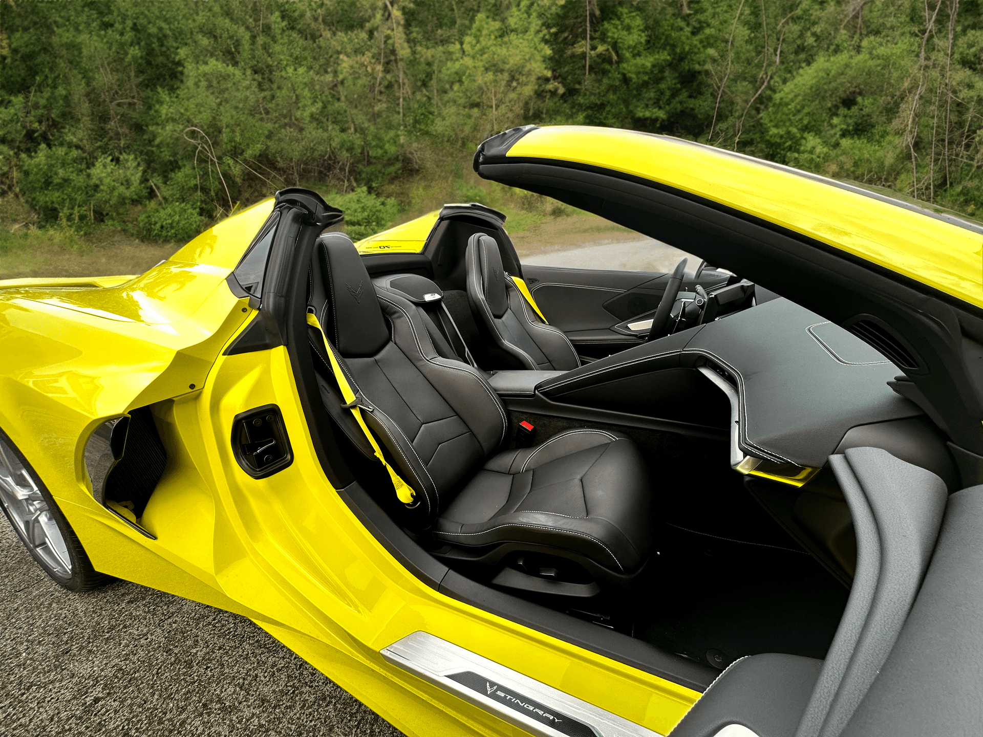 Picture of the car https://harrishawaiiphotos.s3.us-west-2.amazonaws.com/yellowcorvette/interior+ai+background.png